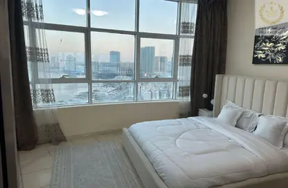 شقة - غرفة نوم - 2 حمامات للبيع في أورينت تاور 1 - أورينت تاور - البستان - عجمان